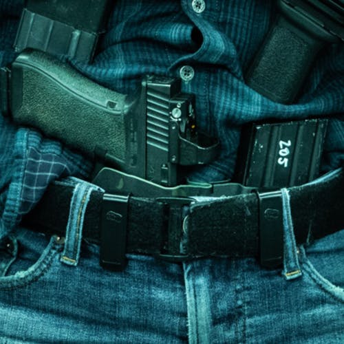 Sidecar holster being worn inside the waistband in front of the appendix