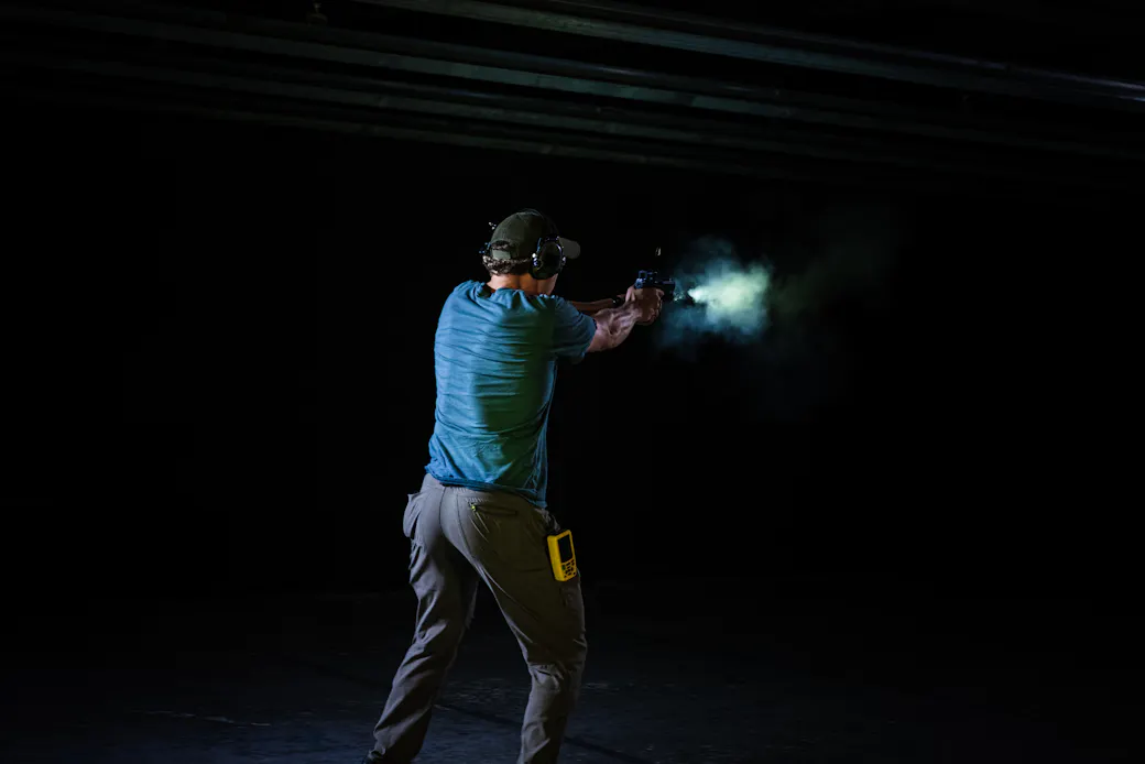 Handgun with a weapon light mounted on the rail, profile view