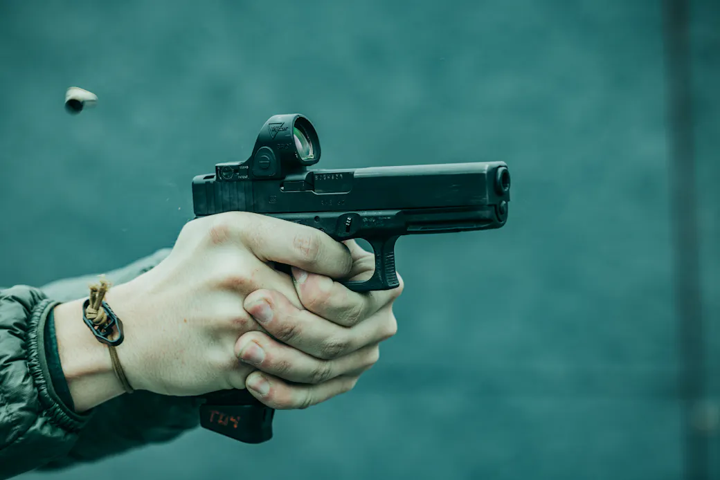 Finger on a handgun trigger showing proper trigger finger placement