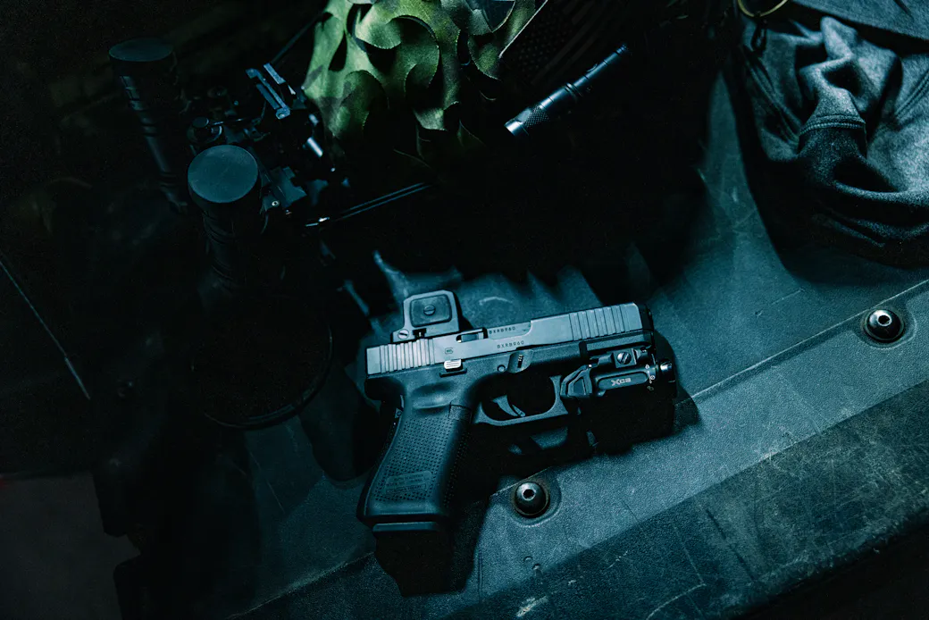 Glock 19, Sig P365 XMacro, Smith &amp; Wesson M&amp;P, and Glock 43X laid out together