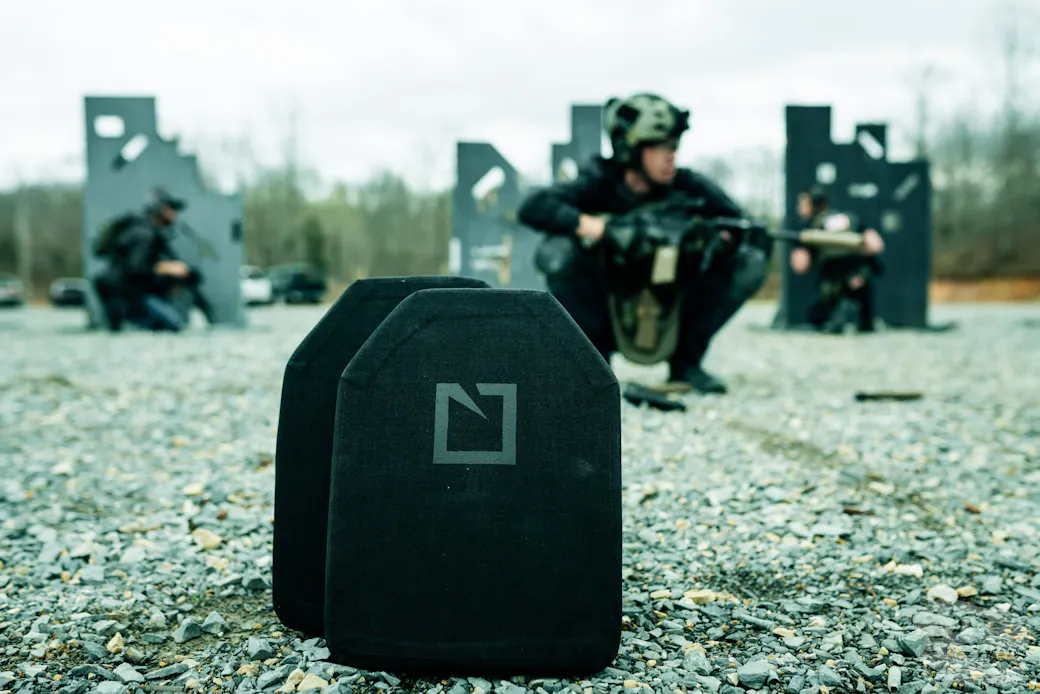 Guys at a range day wearing plate carriers